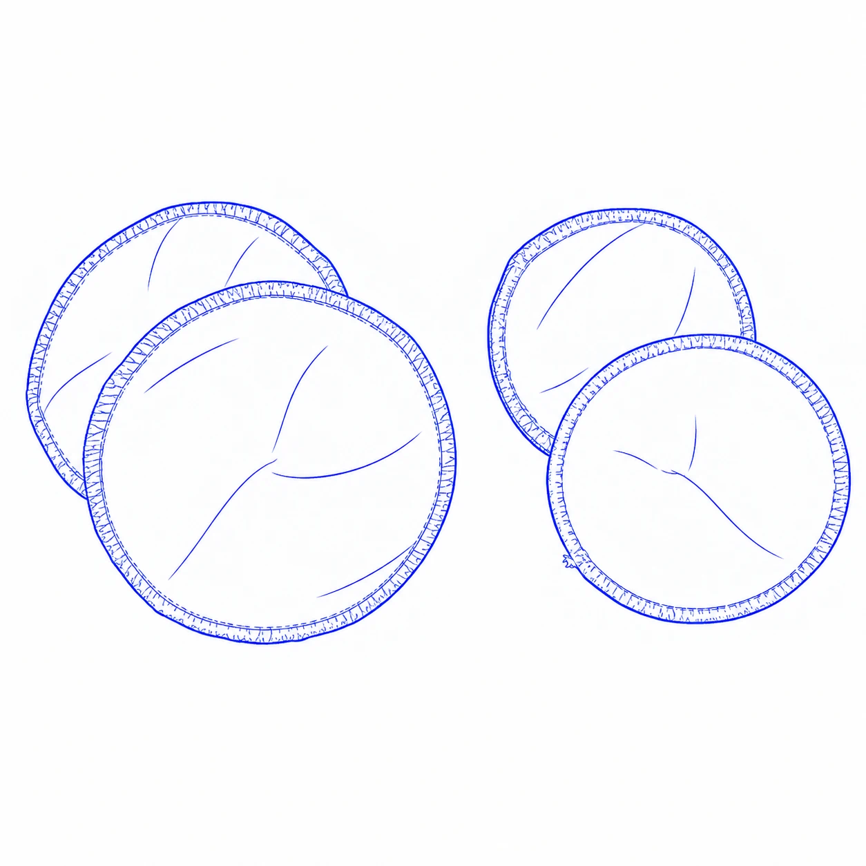Drawing of four round washable breast pads arranged in two overlapping pairs, with stitched borders visible.